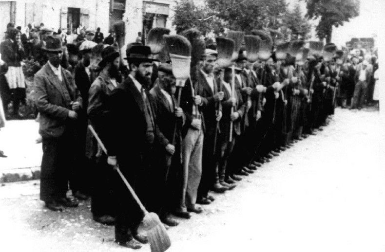 Jews forced to line up with brooms